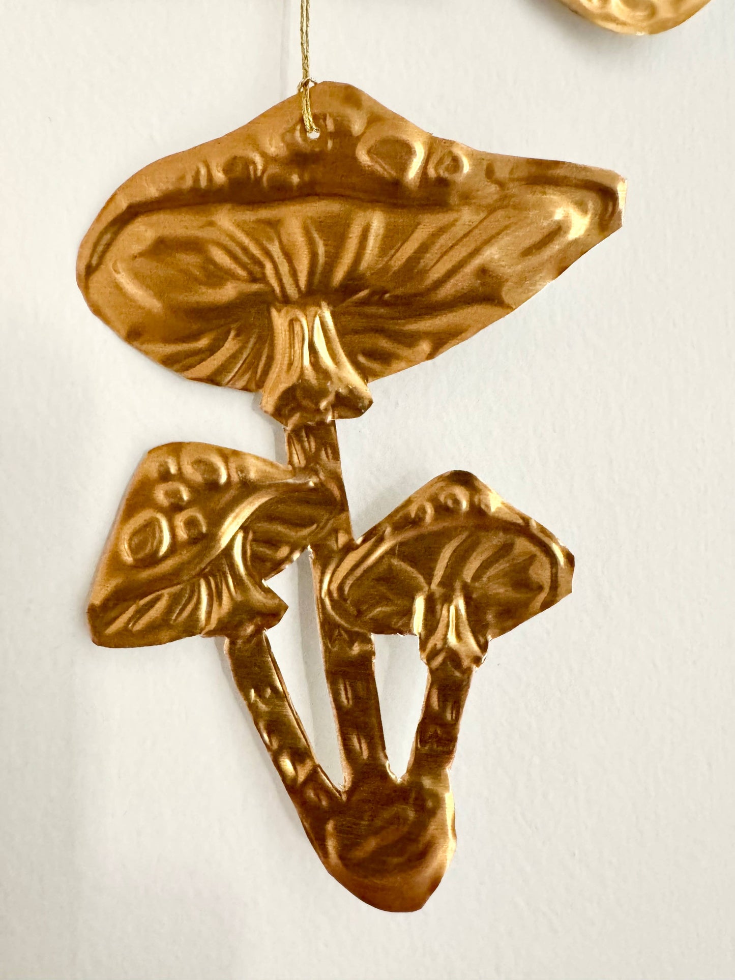 Embossed gold tin Crow and Mushrooms hanging decoration